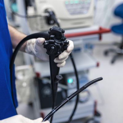 doctor holding a colonoscope and controls