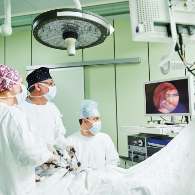 Surgeons performing an operation on a patient’s chest cavity