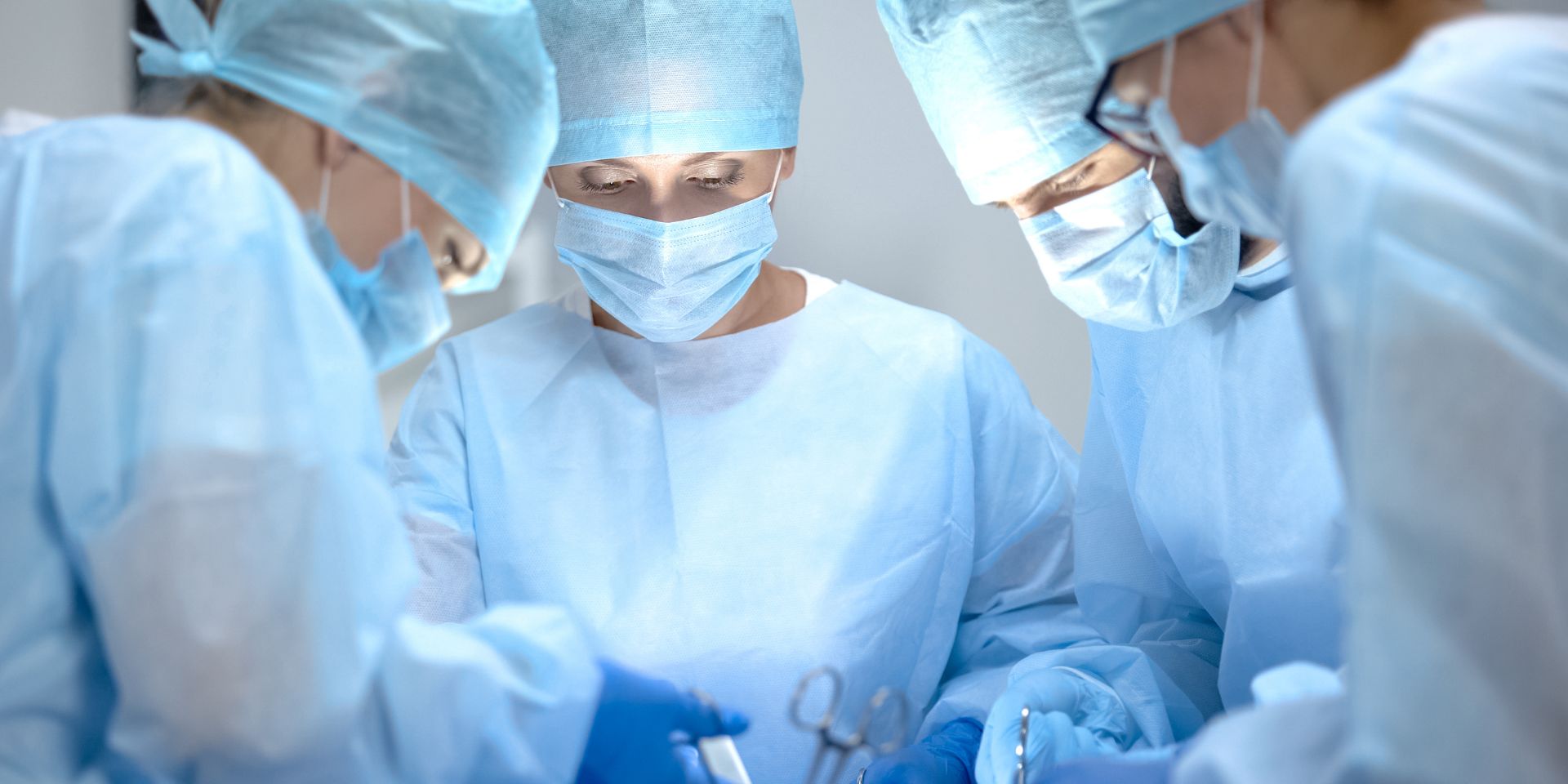 Surgical operating team performing chest surgery in a hospital