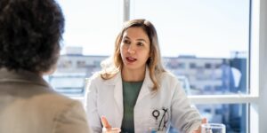 female oncologist meets with her patient about future treatment plans